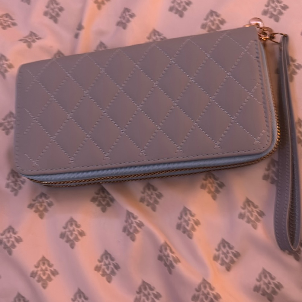 This is a wallet with a wrist strap